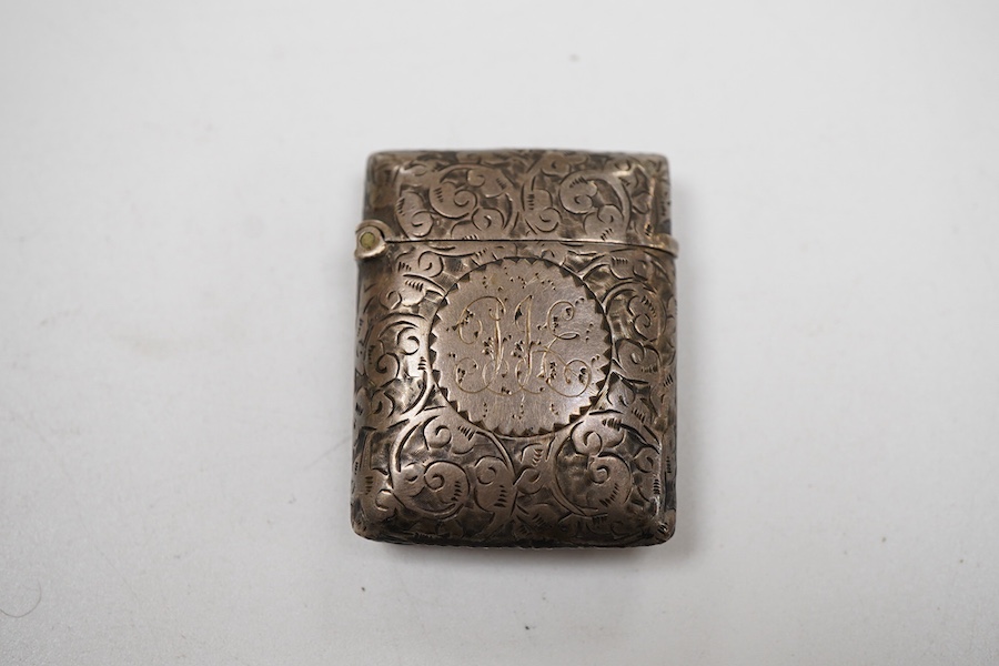 An early Victorian silver rectangular vinaigrette, with engraved chequered decoration, by William Simpson. Birmingham, 1836, 39mm, together with a late Victorian silver vesta case.